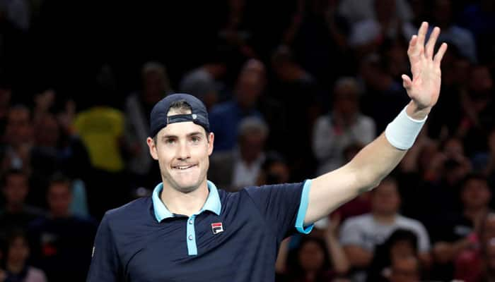 John Isner tames Juan Martin del Potro in Paris Masters to keep ATP Finals&#039; hopes alive