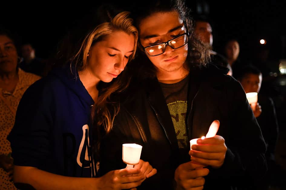 Local residents take part in a vigil for victims of a mass shooting in Sutherland Springs, Texas.