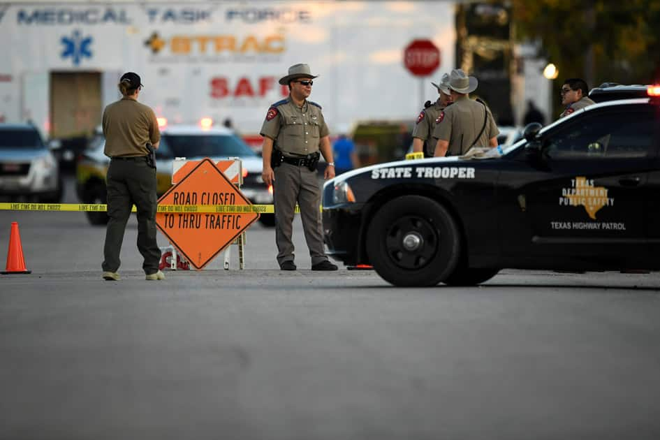 Law enforcement set up along street near First Baptist Church after mass shooting in Sutherland Springs, Texas.