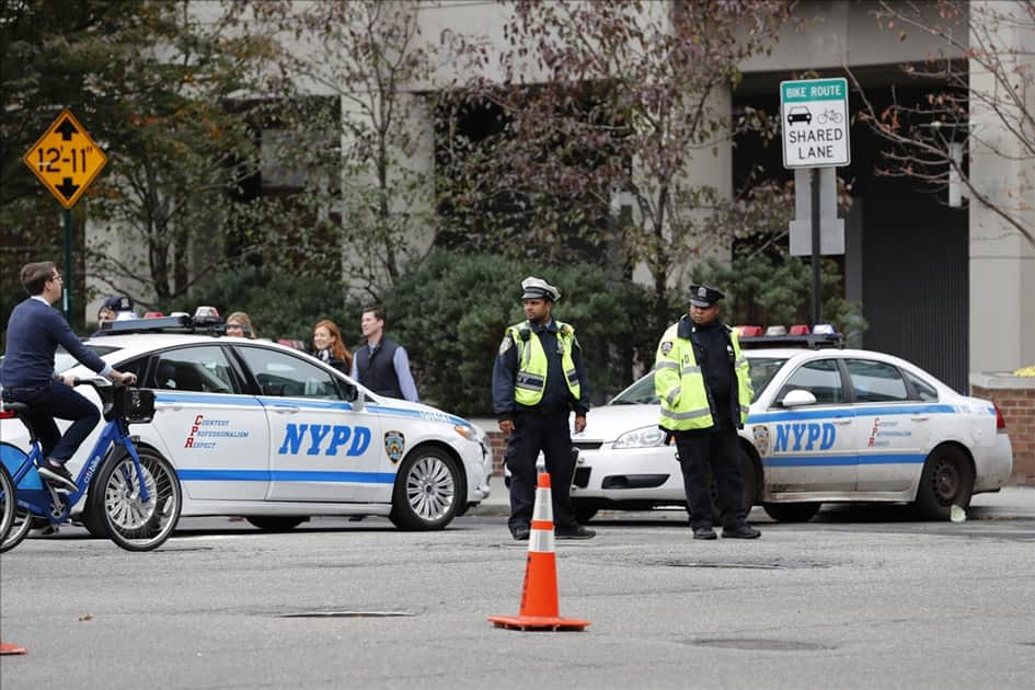 Policemen stand guard during the New York City Marathon in Manhattan of New York, the United States.