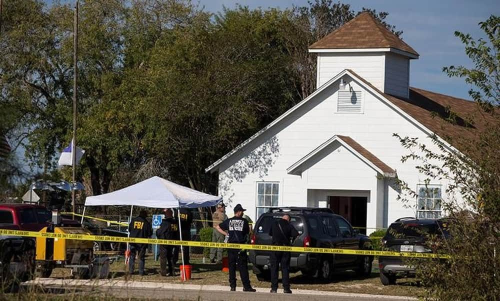 Law enforcement officials investigate a mass shooting at the First Baptist Church in Sutherland Springs.