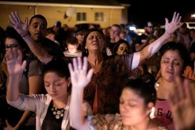 Mourners attend a candle light vigil after a mass shooting at the First Baptist Church in Sutherland Springs.