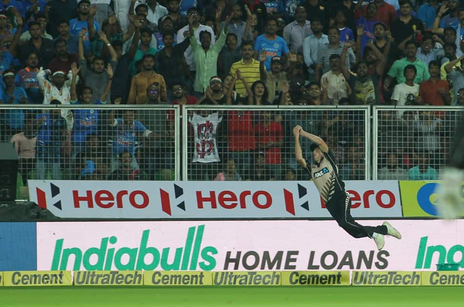 Mitchell Santner of New Zealand takes the catch of Manish Pandey during the third and final T20 International match