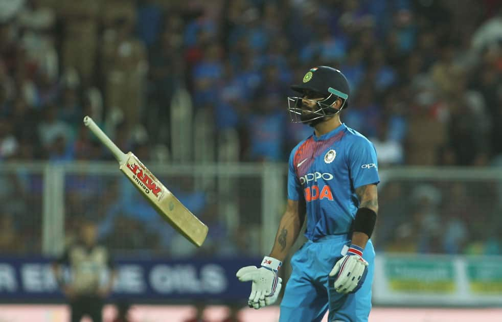 Indian skipper Virat Kohli walks back to the pavilion after getting dismissed during the third and final T20 International match