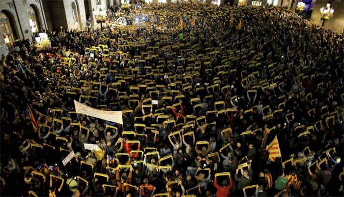 Protesters block roads, highways and train tracks in Catalonia