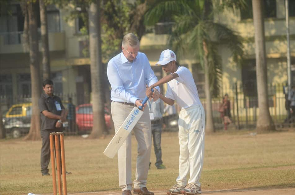 Belgium's King Philippe and Queen Mathilde play cricket with under privileged children during an event hosted by UNICEF in Mumbai.