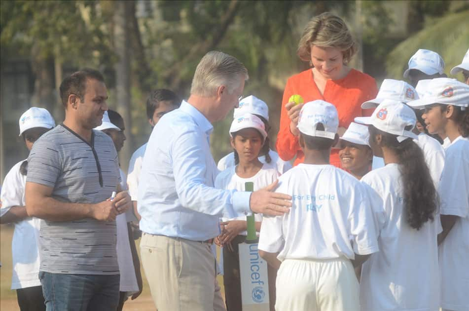 Belgium's King Philippe and Queen Mathilde play cricket with under privileged children during an event hosted by UNICEF in Mumbai.