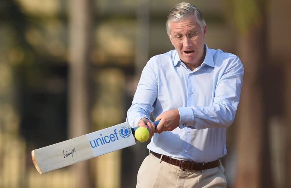 King Philippe of Belgium play cricket at the Oval maidan, in Mumbai.