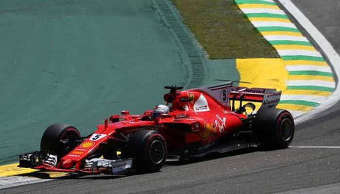 Sebastian Vettel wins Brazilian GP, Lewis Hamilton fourth from pits