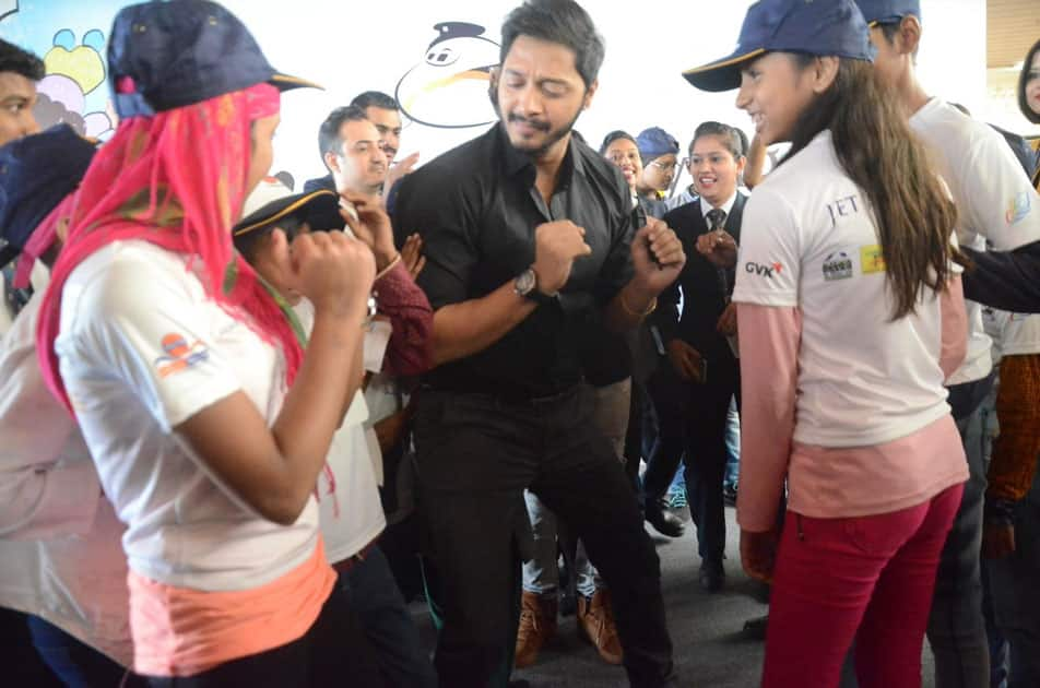 Actor Shreyas Talpade with children during a programme organised to announce 'Flight of Fantasy' by Jet Airways ahead of Children's Day at Chhatrapati Shivaji International Airport in Mumbai.