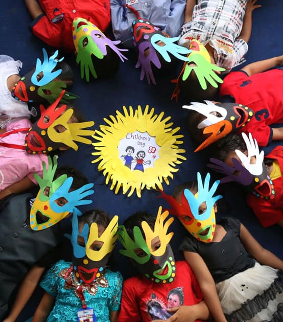 Nepalese children pose for photos as they celebrate the National Children's Day in Kathmandu, Nepal.