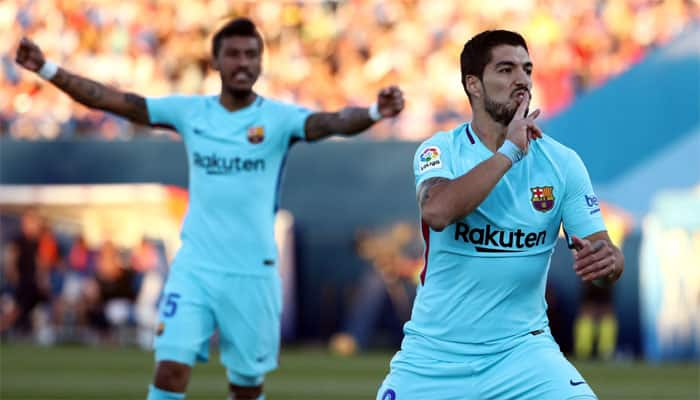 Luis Suarez doubles stretches Barcelona&#039;s La Liga lead