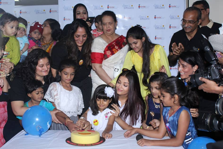 Actress Aishwarya Rai Bachchan along with her mother Brindya Rai, daughter Aaradhya Bachchan and children born with cleft lips and palates of 'Smile Train' celebrates her father Krishnaraj Rai's birth anniversary at Shushrusha Hospital, in Mumbai.