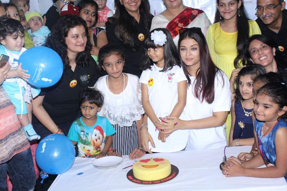 Actress Aishwarya Rai Bachchan along with her mother Brindya Rai, daughter Aaradhya Bachchan and children born with cleft lips and palates of 'Smile Train' celebrates her father Krishnaraj Rai's birth anniversary at Shushrusha Hospital, in Mumbai.