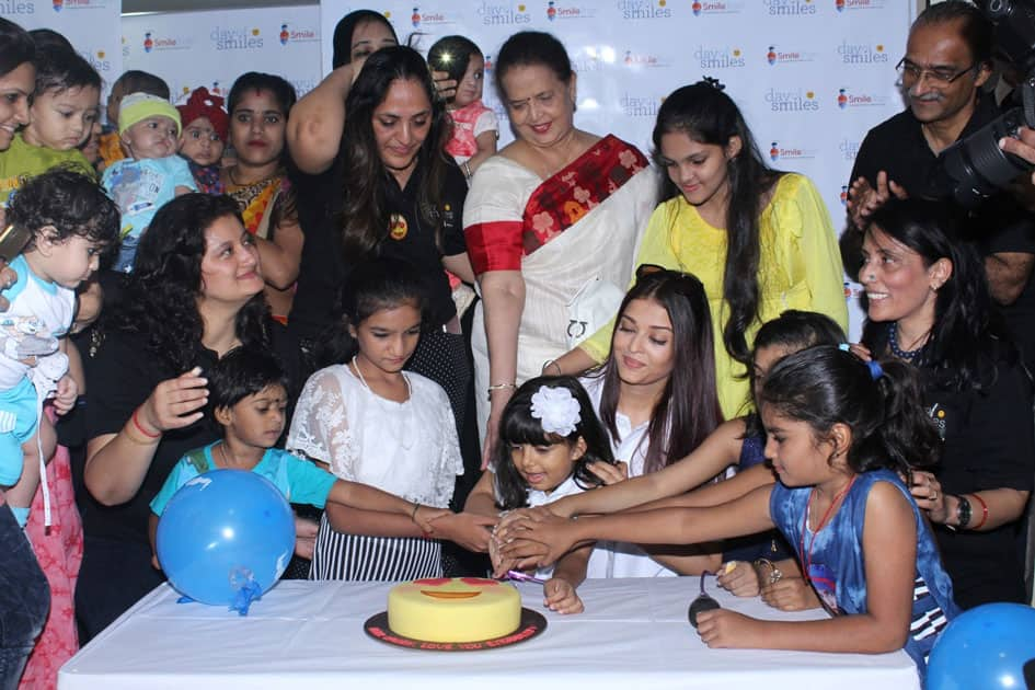 Actress Aishwarya Rai Bachchan along with her mother Brindya Rai, daughter Aaradhya Bachchan and children born with cleft lips and palates of 'Smile Train' celebrates her father Krishnaraj Rai's birth anniversary at Shushrusha Hospital, in Mumbai.