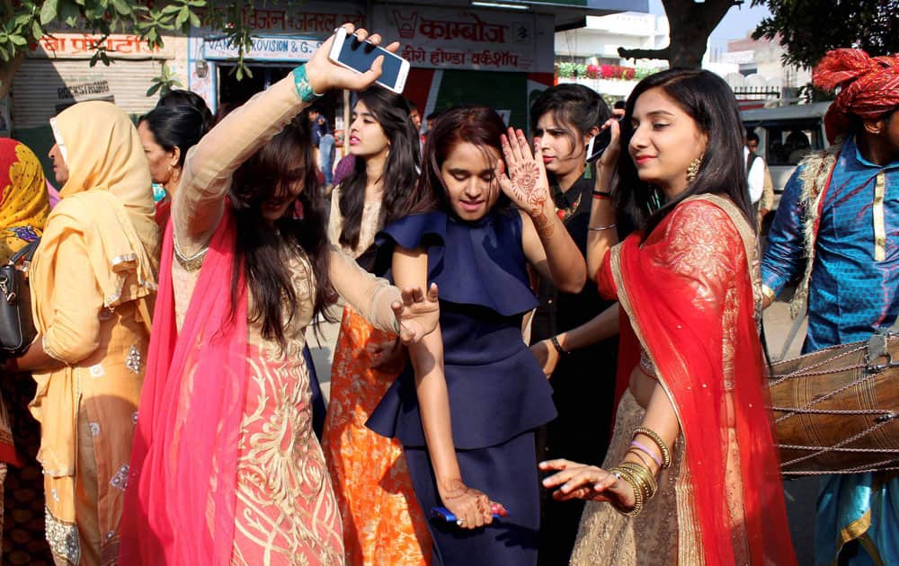 Family members and relatives dance during speedster Bhuvneshwar Kumar's marriage procession in Meerut. Family members and relatives dance during speedster Bhuvneshwar Kumar's marriage procession in Meerut.