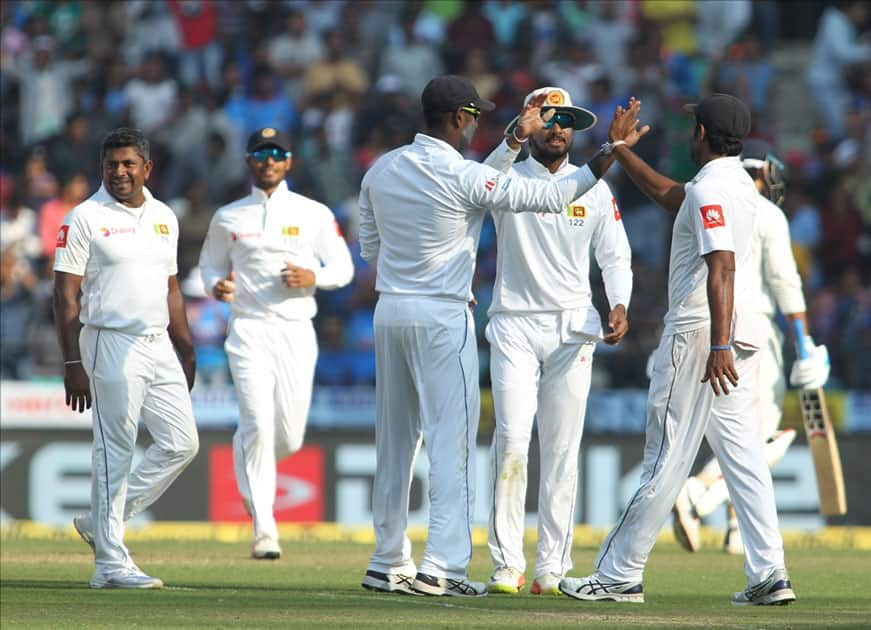 Rangana Herath of Sri Lanka celebrates fall of Murali Vijay's wicket on Day 2 of the second test match between India and Sri Lanka at Vidarbha Cricket Association Stadium in Nagpur.