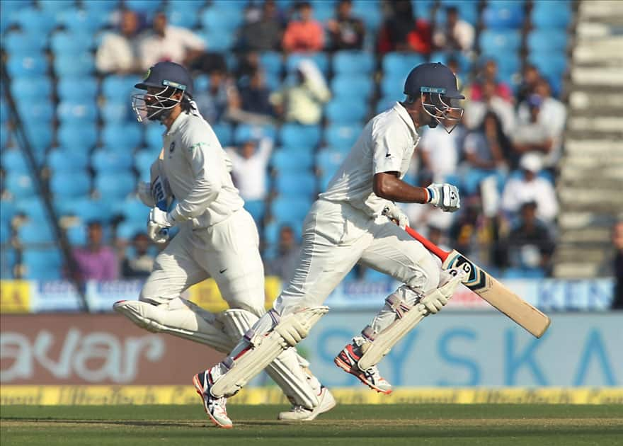 Cheteshwar Pujara and Murali Vijay of India run between the wickets on Day 2 of the second test match between India and Sri Lanka at Vidarbha Cricket Association Stadium in Nagpur.