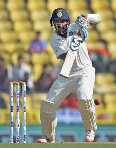 Indian batsman Cheteshwar Pujara plays a shot during 2nd test match played against Sri Lanka in Nagpur.