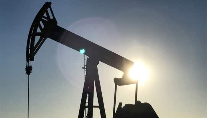 US oil dips on increased drilling, but OPEC cuts support global markets