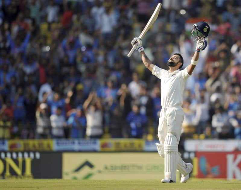 India's captain Virat Kohli celebrates after his double-century during Day 3 of the 2nd cricket test match against Sri Lanka in Nagpur.