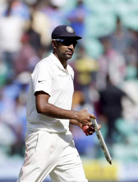 Indian bowler R Ashwin walks off the field after the end of the 2nd cricket test match against Sri Lanka in Nagpur.