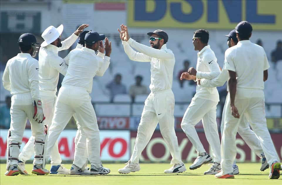 Indian captain Virat Kohli celebrates fall of Dimuth Karunaratne`s wicket with his teammates on Day 4 of the second test match between India and Sri Lanka at Vidarbha Cricket Association Stadium in Nagpur.