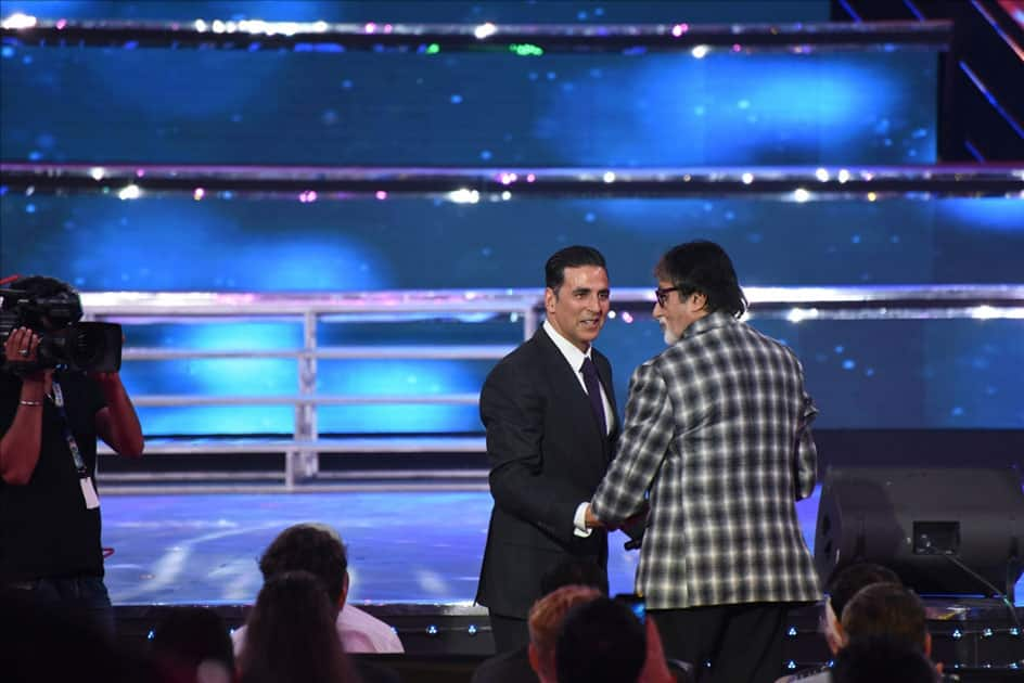 Actors Akshay Kumar with Amitabh Bachchan during closing ceremony of 48th International Film Festival of India in Panaji, Goa.