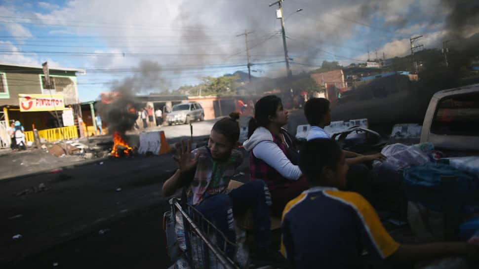 Honduras awaits presidential vote count as army enforces curfew