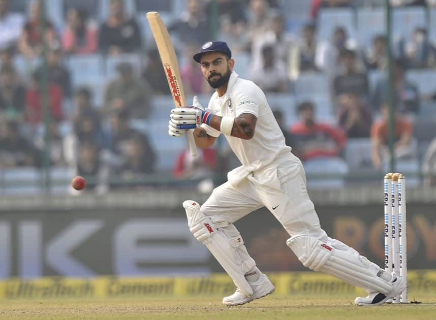 Virat Kohli plays a shot against Sri Lanka during the first day of the third cricket test match at Feroz Shah Kotla, in New Delhi.