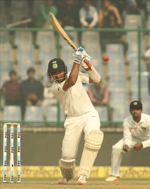 India's Cheteshwar Pujara in action on Day 1 of the third test match between India and Sri Lanka at Feroz Shah Kotla Stadium in New Delhi.