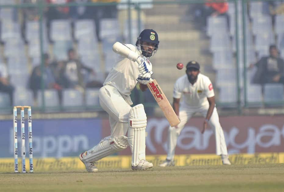 Indian batsman Shikhar Dhawan plays a shot during the third cricket test match against Sri Lanka at Feroz Shah Kotla, in New Delhi.