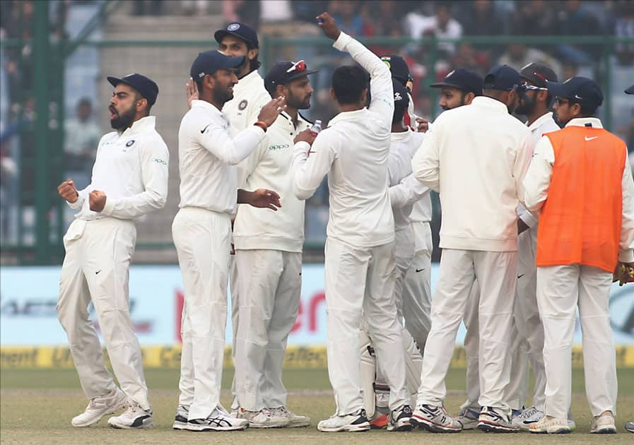 Indians celebrate Dilruwan Perera's wicket on Day 2 of the third test match between India and Sri Lanka at Feroz Shah Kotla Stadium in New Delhi.