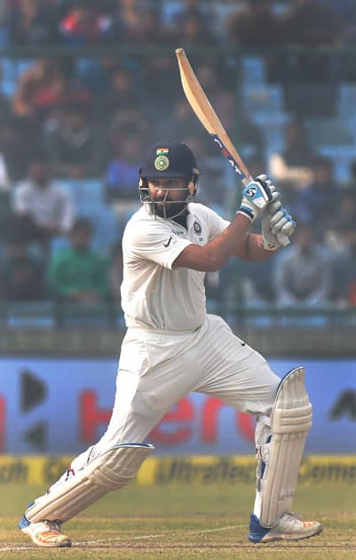 India's Rohit Sharma plays a shot during the second day of the third cricket test match against Sri Lanka at Feroz Shah Kotla, in New Delhi.