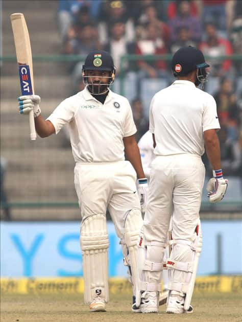 India's Rohit Sharma celebrates his half-century on Day 2 of the third test match between India and Sri Lanka at Feroz Shah Kotla Stadium in New Delhi.