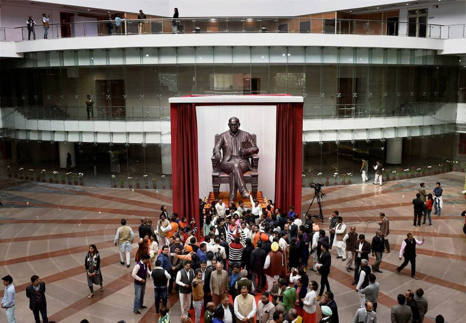 People clicking pictures of a statue of Dr. BR Ambedkar installed at Dr. Ambedkar International Centre, that was dedicated to the nation by the Prime Minister in New Delhi.