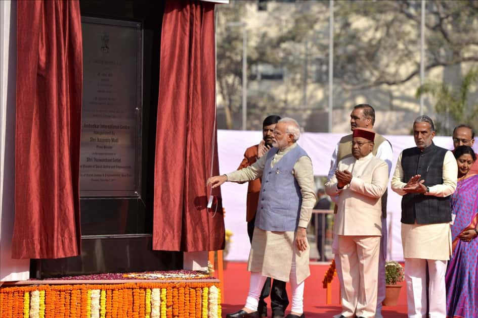 Prime Minister Narendra Modi unveils the plaque to inaugurate Dr. Ambedkar International Centre in New Delhi.