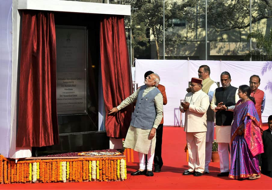 Prime Minister Narendra Modi unveils a plaque to dedicate Dr Ambedkar International Centre to the nation, in New Delhi.