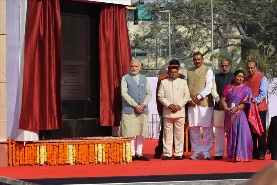 Prime Minister Narendra Modi unveils the plaque to dedicate Dr. Ambedkar International Centre to the Nation in New Delhi.