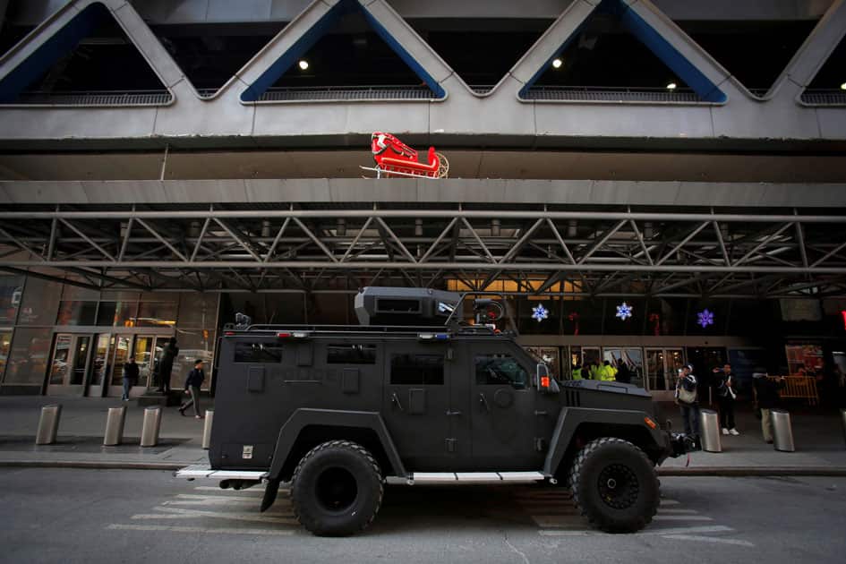 An armored vehicle belonging to the New York Port Authority sits beneath a Christmas decoration at the entrance of the New York Port Authority Bus Terminal following an attempted detonation during the morning rush hour, in New York City. An armored vehicle belonging to the New York Port Authority sits beneath a Christmas decoration at the entrance of the New York Port Authority Bus Terminal following an attempted detonation during the morning rush hour, in New York City.