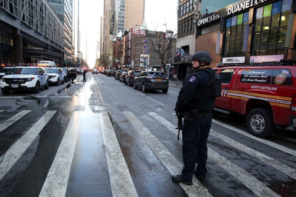 New York Police Department (NYPD) officers stand guard near Port Authority Bus Terminal after reports of an explosion in New York. New York Police Department (NYPD) officers stand guard near Port Authority Bus Terminal after reports of an explosion in New York.