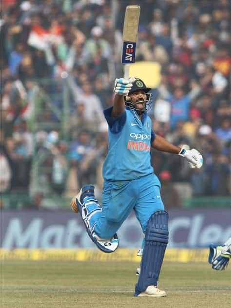 Indian captain Rohit Sharma celebrates his third ODI double century during the second One Day International (ODI) match between India and Sri Lanka at Punjab Cricket Association IS Bindra Stadium in Mohali.