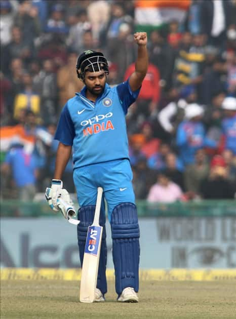 Indian captain Rohit Sharma reacts after scoring a century during the 2nd One Day International (ODI) match between India and Sri Lanka at Punjab Cricket Association IS Bindra Stadium in Mohali.