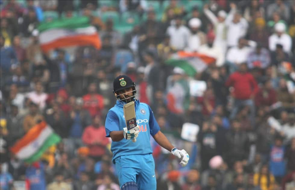 Indian captain Rohit Sharma celebrates his half-century during the 2nd One Day International (ODI) match between India and Sri Lanka at Punjab Cricket Association IS Bindra Stadium in Mohali.