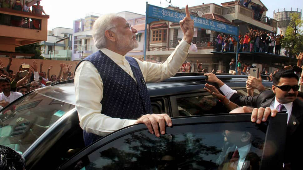 Then he stood on the footboard of his car and waved to the crowd