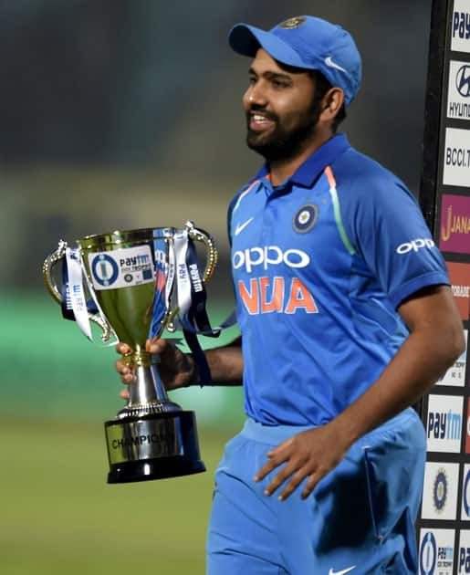 Indian team captian Rohit Sharma with the trophy after winning the 3rd and final ODI match against Sri Lanka in Vizag.