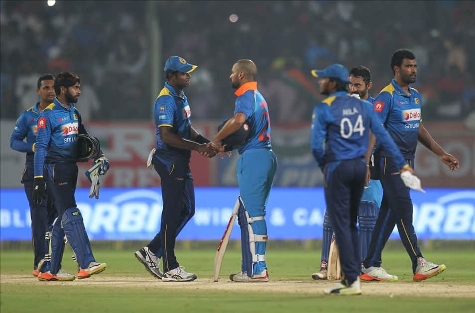 India's Shikhar Dhawan being greeted by Sri Lankan players after India won the third ODI match against Sri Lanka at Dr. Y.S. Rajasekhara Reddy ACA-VDCA Cricket Stadium in Visakhapatnam.