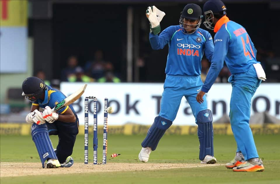 Akila Dananjaya of Sri Lanka gets dismissed during the third ODI between India and Sri Lanka at Dr. Y.S. Rajasekhara Reddy ACA-VDCA Cricket Stadium in Visakhapatnam.