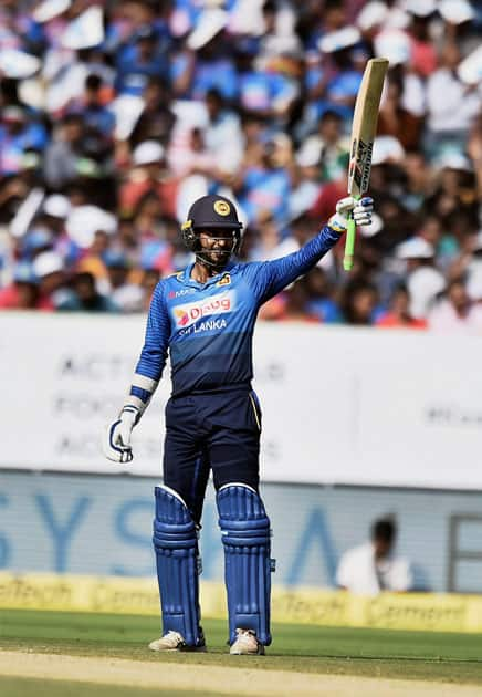 Sri Lankan player Upul Tharanga celebrates his half century during the 3rd and final ODI cricket match against India.