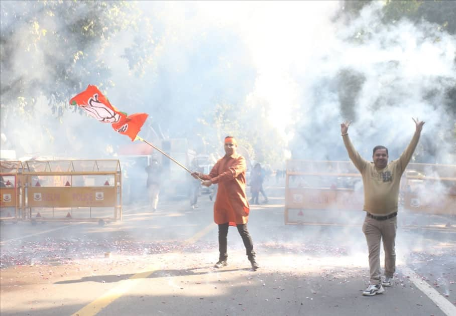 A party worker during celebrations over the party's performance in Himachal Pradesh and Gujarat assembly elections in New Delhi.